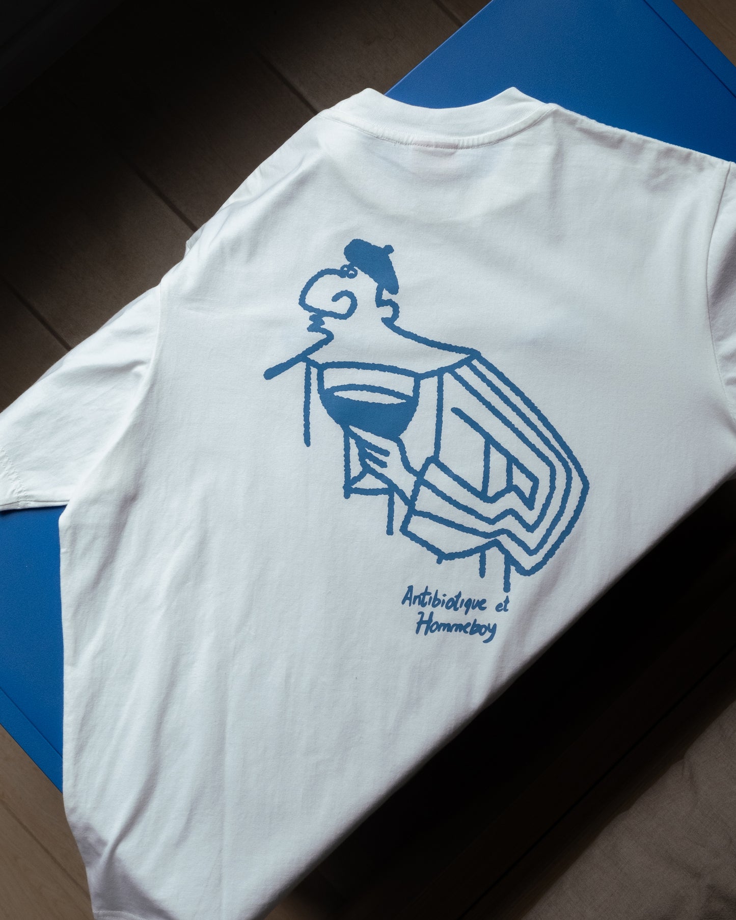'Galerie' SS Tee (Warm White) - Hommeboy & Antibiotic Smile